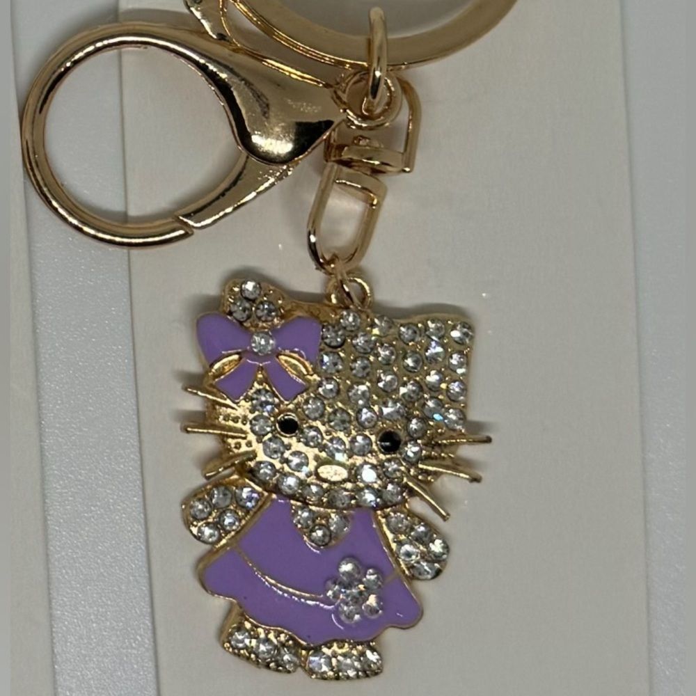 BAG CHARM  Hello Kitty Gold Tone Crystal Purple Bow and Dress Bag Charm Keychain